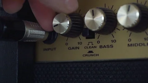 Gain control being turned up on amplifier Video stock 95211771