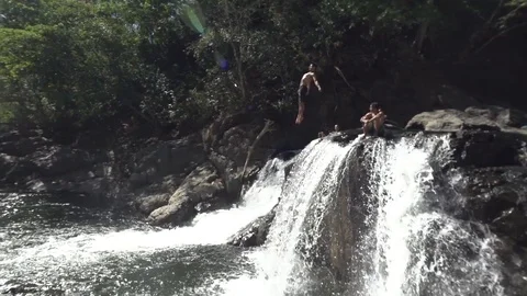 Gainer Back Flip Of Off Waterfall in Slow Motion Stock Footage 87723629