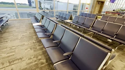 Gainesville, FL - June 21,2024: Empty seats at an airport departure gate Stock Footage 278239191
