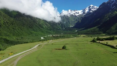Gaining Altitude Drone Flight Toward Caucasus Mountain Base 4K RAW Stock Footage 339735205