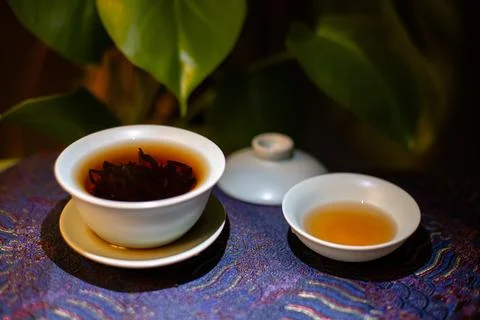 Gaiwan on the tea table selective focus. Gongfu cha tea ceremony. Stock Photos