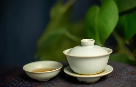 Gaiwan on the tea table selective focus. Gongfu cha tea ceremony. Stock Photos