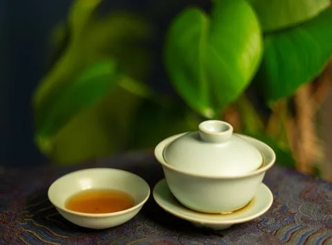 Gaiwan on the tea table selective focus. Gongfu cha tea ceremony. Stock Photos