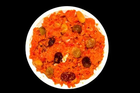Gajar halwa is carrot based pudding made with khya,milk,almond,pistachio. Stock Photos