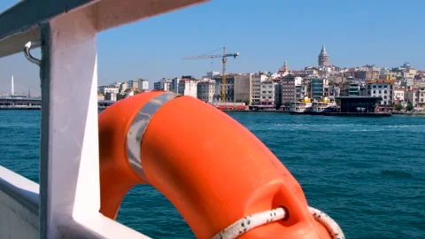 Galata Tower distant view from a ferry in Istanbul Turkey slow motion Stock Footage 201007057