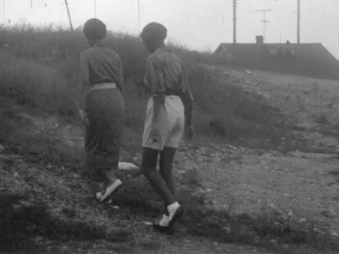 Galax, VA - 8/26/59: Two black women walk up hill Stock Footage 232065231