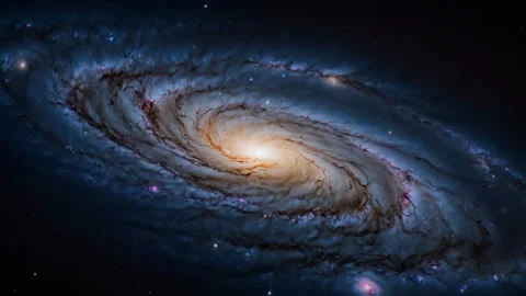 The galaxy features a bright, luminous core at its center. Stock Footage 297456740