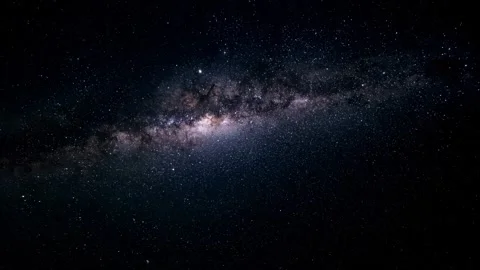 The galaxy features a bright, luminous core at its center. Stock Footage 297848606