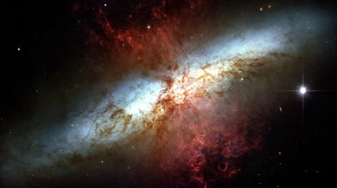 Galaxy, look with a side and a huge bright quasar on the right below Stock-Footage 47373371