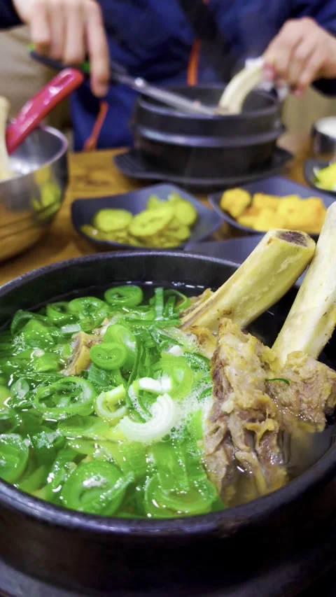 Galbitang or Korean Beef Short Rib Soup bubbling and served on a table 스톡 동영상 339274354
