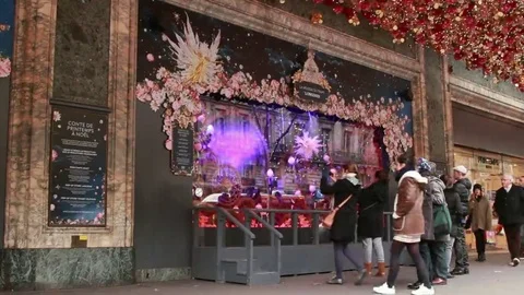 Galeries Lafayette and black guy shows "peace sign" in the camera. Video stock 69225493