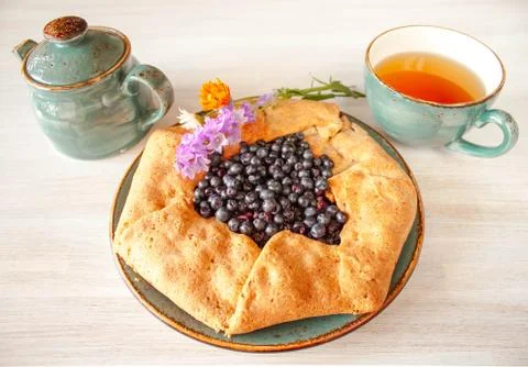 Galeta galette tart cake pie of whole grain flour with blueberries on a white Stock Photos