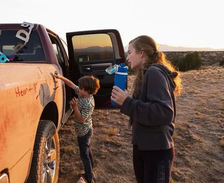 Galisteo Basin,United States,children writing on dirty pickup truck Stock Photos