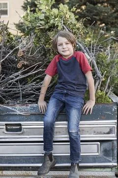 Galisteo Basin,United States,portrait of young boy sitting on old pick up tru Stock Photos
