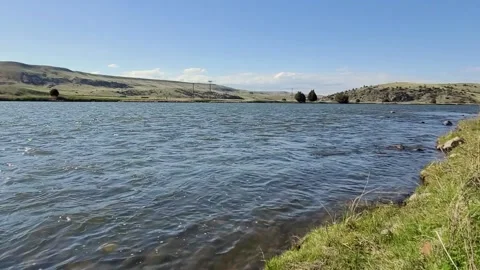 Gallatin River flowing away Stock Footage 130917198