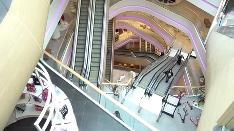 Gallery of escalators in shopping center - people go up and down Stock Footage