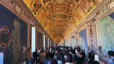 The Gallery of Maps inside of the Vatican Museums crowded with tourist people in Stock-Footage 250845650