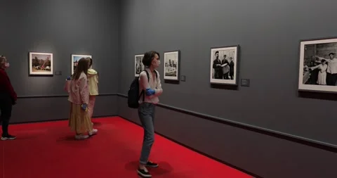 Gallery visitors in face masks taking a tour at  exhibition after covid-19 Stock-Footage 135602437