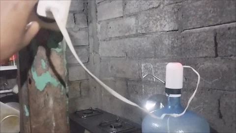 Gallon water pump charge Stock Footage 291592262