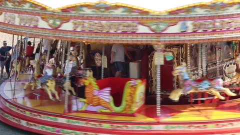 Galloping horse carousel fairground ride Brighton beach Sussex UK Stock Footage 157145939