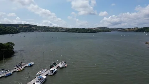 Galmpton Creek, Devon, England: DRONE VIEWS: The Creek, boats and the River Dart Stock Footage 244718195