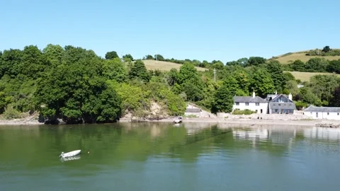 Galmpton Creek, South Devon, England: Riverfront house and isolated boats Stock Footage 201208162