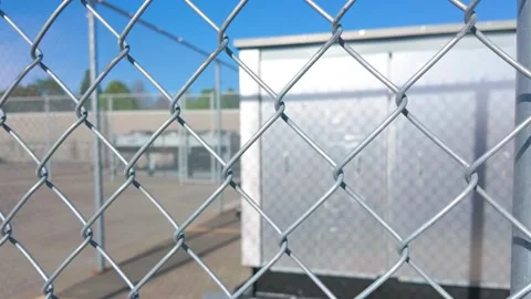 Galvanized Chain Link Fence in Front of Industrial Facility Stock Footage 333488762