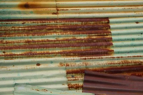 Galvanized green sheet is rusty that is old and used for a long time. Stock Photos