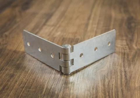Galvanized hinge which are used for the production of soft furniture Stock Photos
