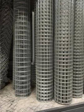 Galvanized industrial wire mesh prepared in rolls for fencing installation .. Stock Photos