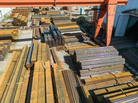 Galvanized iron pipes stack and steel rectangular bars of metal Stock Photos