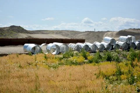 Galvanized metal culvert pipe on construction site Foto stock