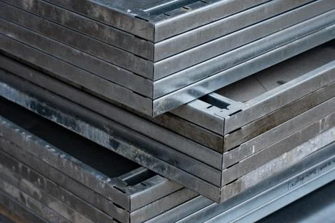 Galvanized metal formwork sheets placed in compact aligned stack Stock Photos