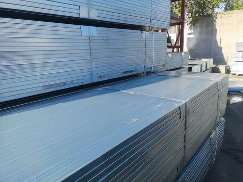 Galvanized metal profiles for construction work are packaged at the wholesa.. Stock Photos