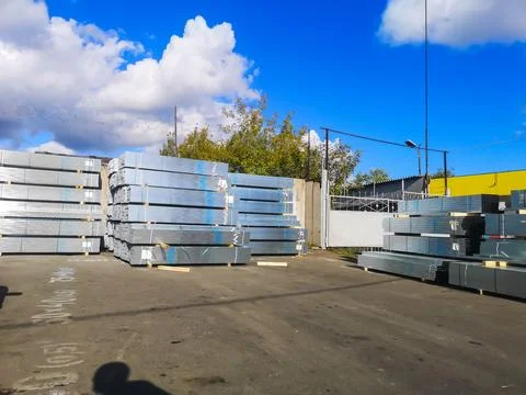 Galvanized metal profiles for construction work are packaged at the wholesa.. Stock Photos