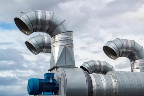 The galvanized pipes of the branching system are installed on the roof of the Stock Photos