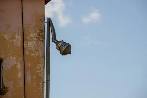 Galvanized Rain Gutter, Rainwater Pipe and Connector Nozzle at tiled Roof Stock Photos