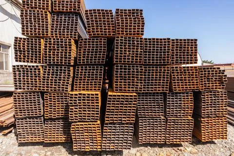 Galvanized stainless steel rectangular bars of metal in the steel factory Stock Photos