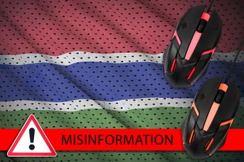 Gambia flag and two computer mouses. Misinformation during Coronavirus or 201 写真素材