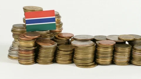 Gambian flag waving with stack of money coins Stock Footage 71930024