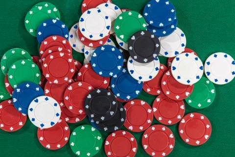 Gambing chips on green table Stock Photos