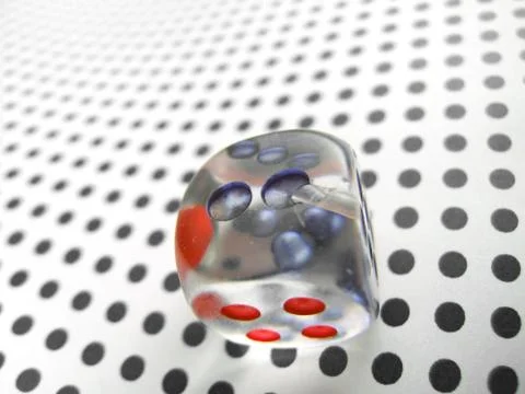 Gamblig dice on doted background Stock Photos