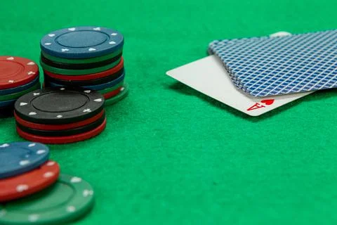 Gambling chips on computer keyboard on green background Stock Photos