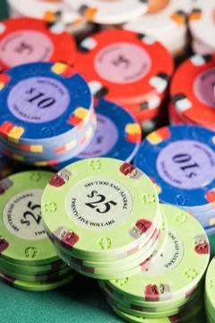 Gambling chips on a gaming table Stock Photos