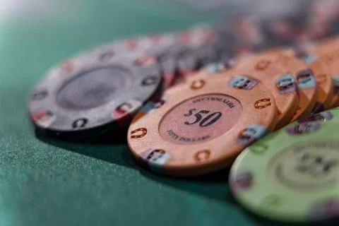 Gambling chips on a gaming table Stock Photos