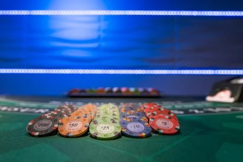 Gambling chips on a gaming table Stock Photos
