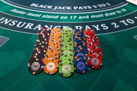 Gambling chips on a gaming table Stock Photos