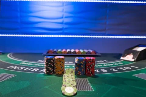 Gambling chips on a gaming table Stock Photos