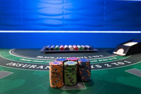 Gambling chips on a gaming table Stock Photos