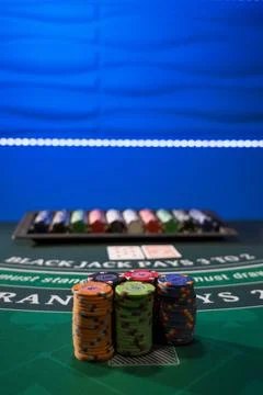 Gambling chips on a gaming table Stock Photos